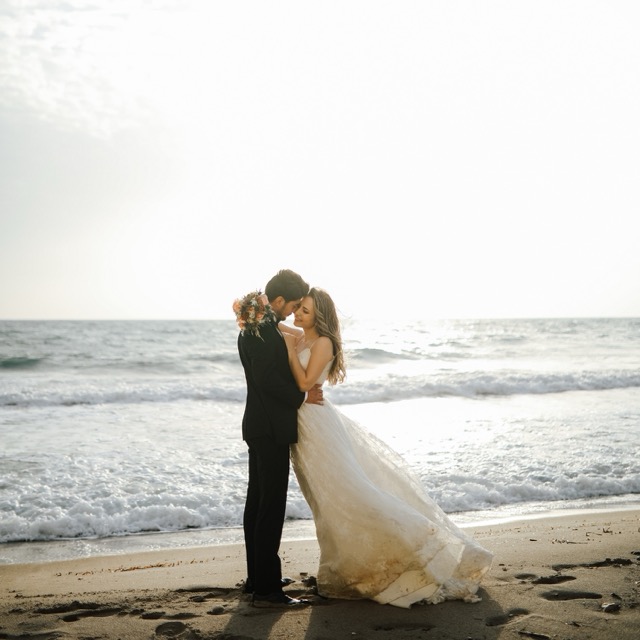 A couple looking at a map, planning their destination wedding.
