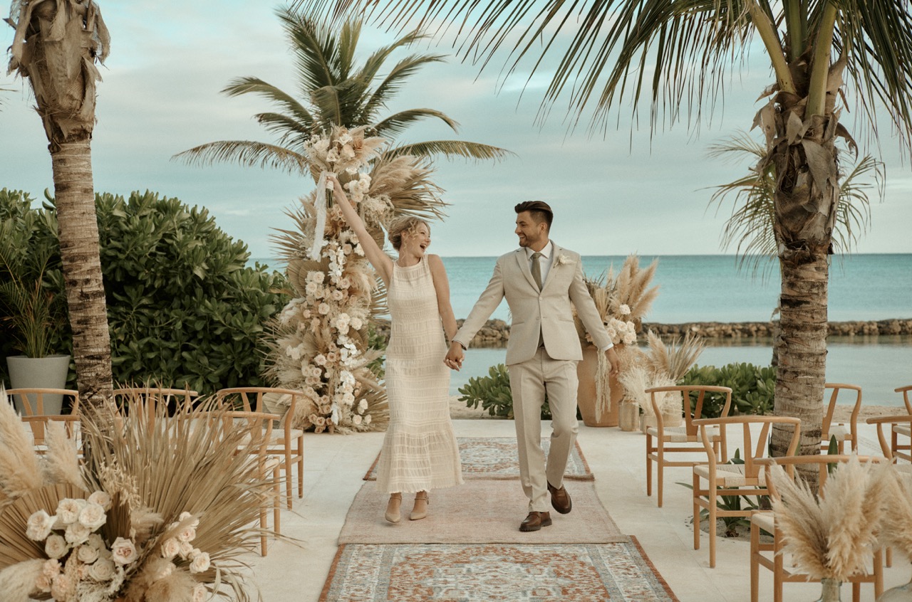 A beautiful beach wedding setup at sunset.